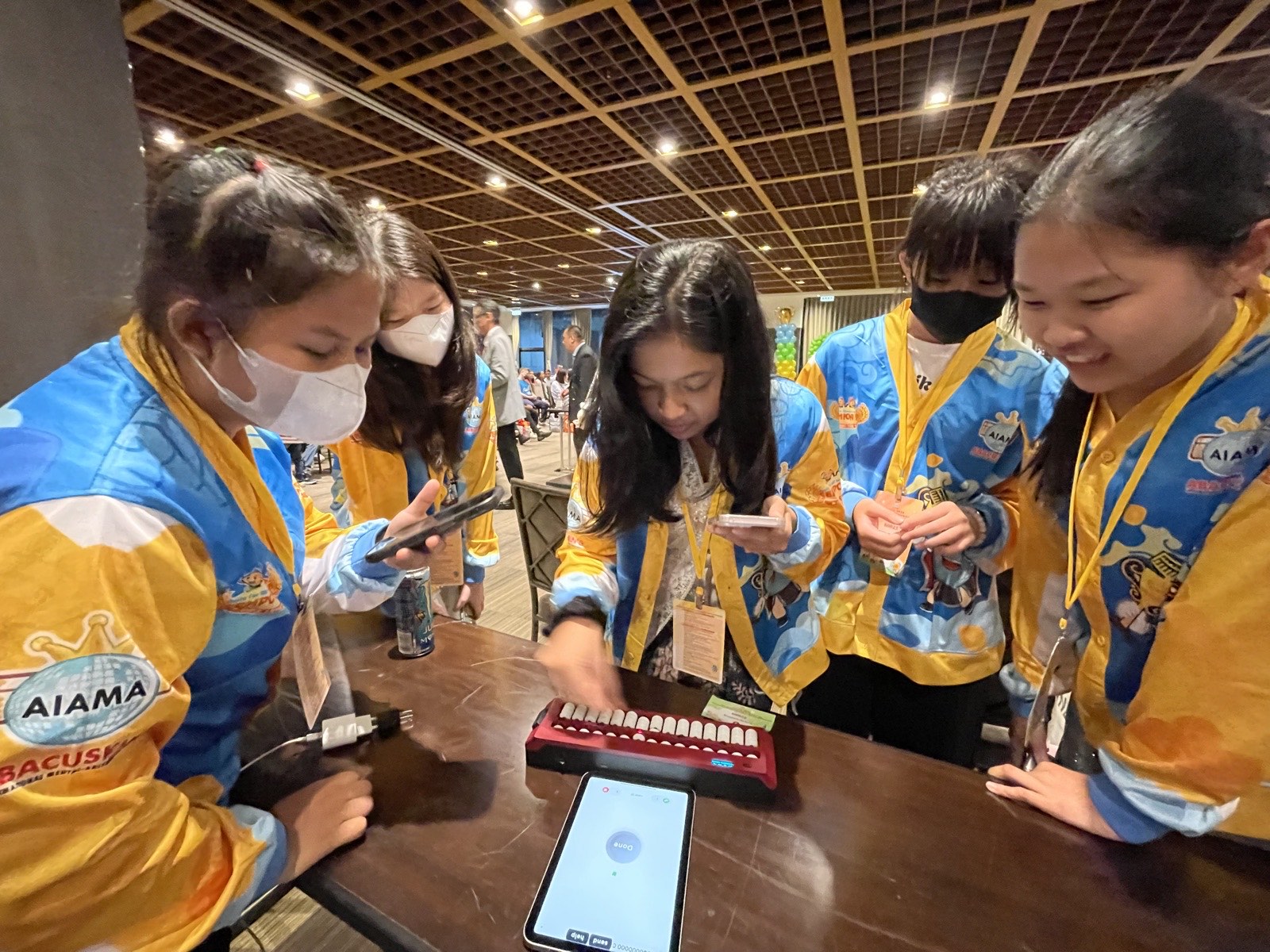 Abacus Olympiad competitors practicing with the Undugu smart abacus at AIAMA 2026